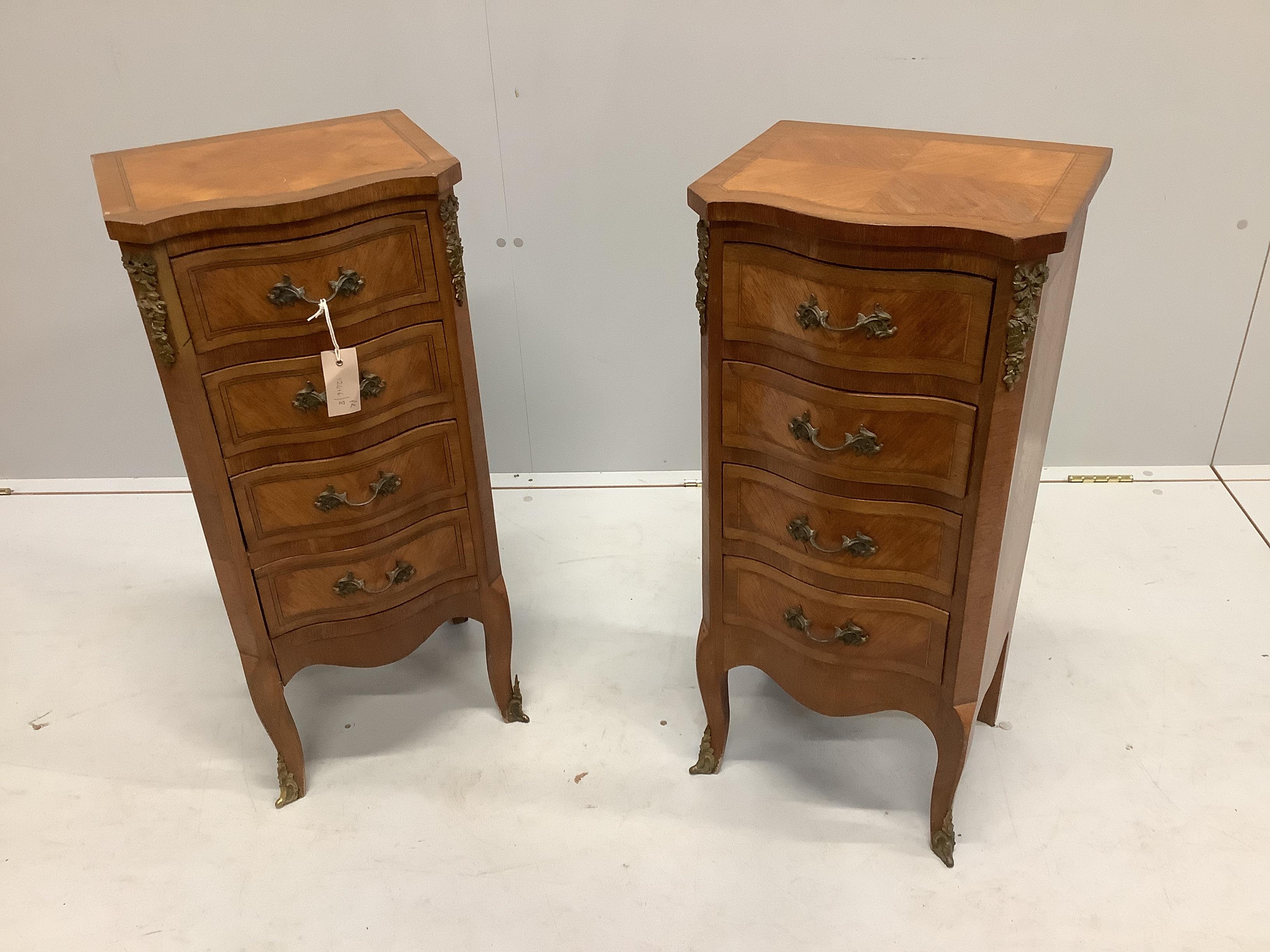 A pair of early 20th century French kingwood serpentine four drawer bedside chests, width 35cm, depth 28cm, height 77cm
